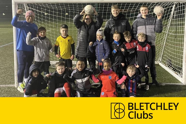 Bletchley Clubs - Footballer community stand in front of goal